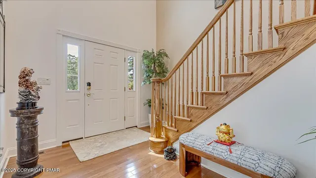 a kitchen with stainless steel appliances granite countertop a refrigerator a sink and a stove