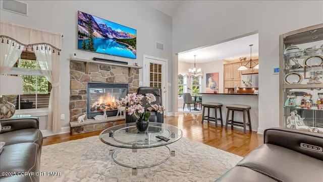a view of a dining room with furniture wooden floor and chandelier