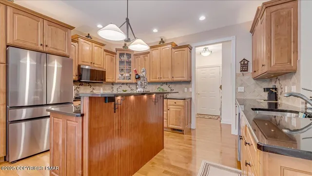 a bedroom with a bed and a mirror