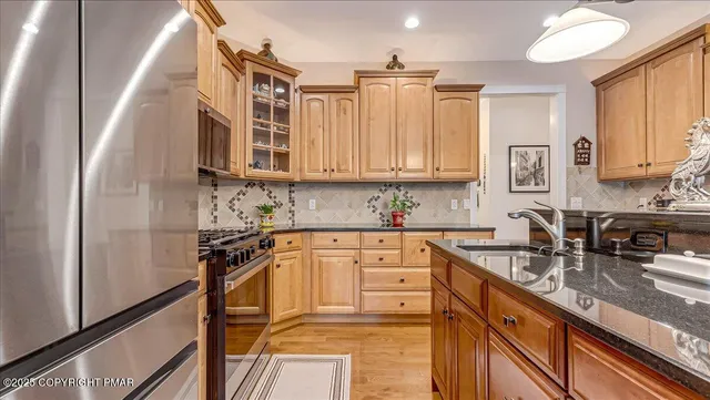 a bathroom with a bathtub next to a window