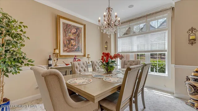 a bed room with a bed and a chandelier