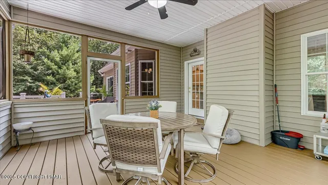 a living room with a couch and chandelier