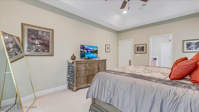 a roof deck with couches and wooden floor