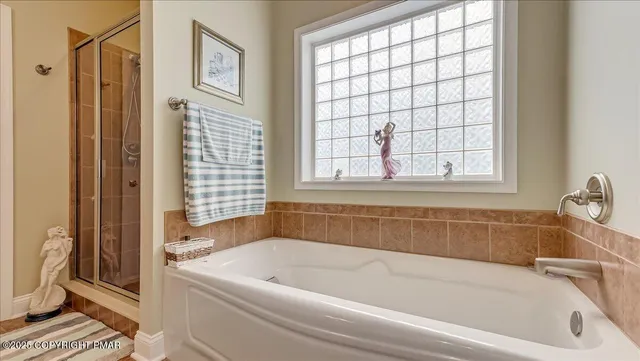 a view of a deck with table and chairs with wooden floor and fence