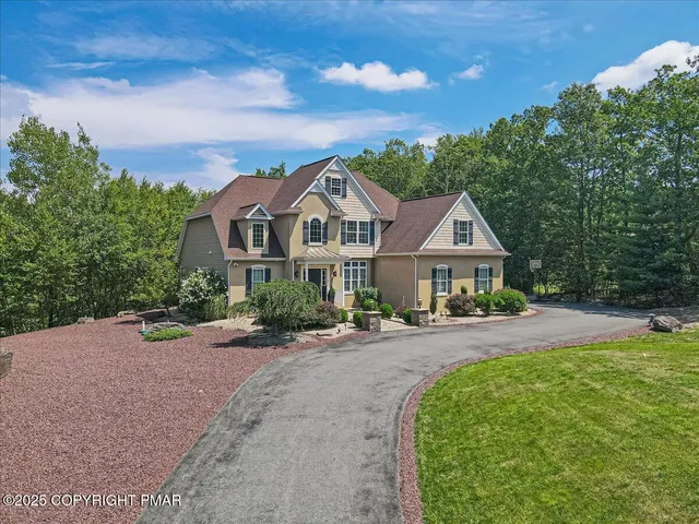 a view of entryway with wooden floor and stairs
