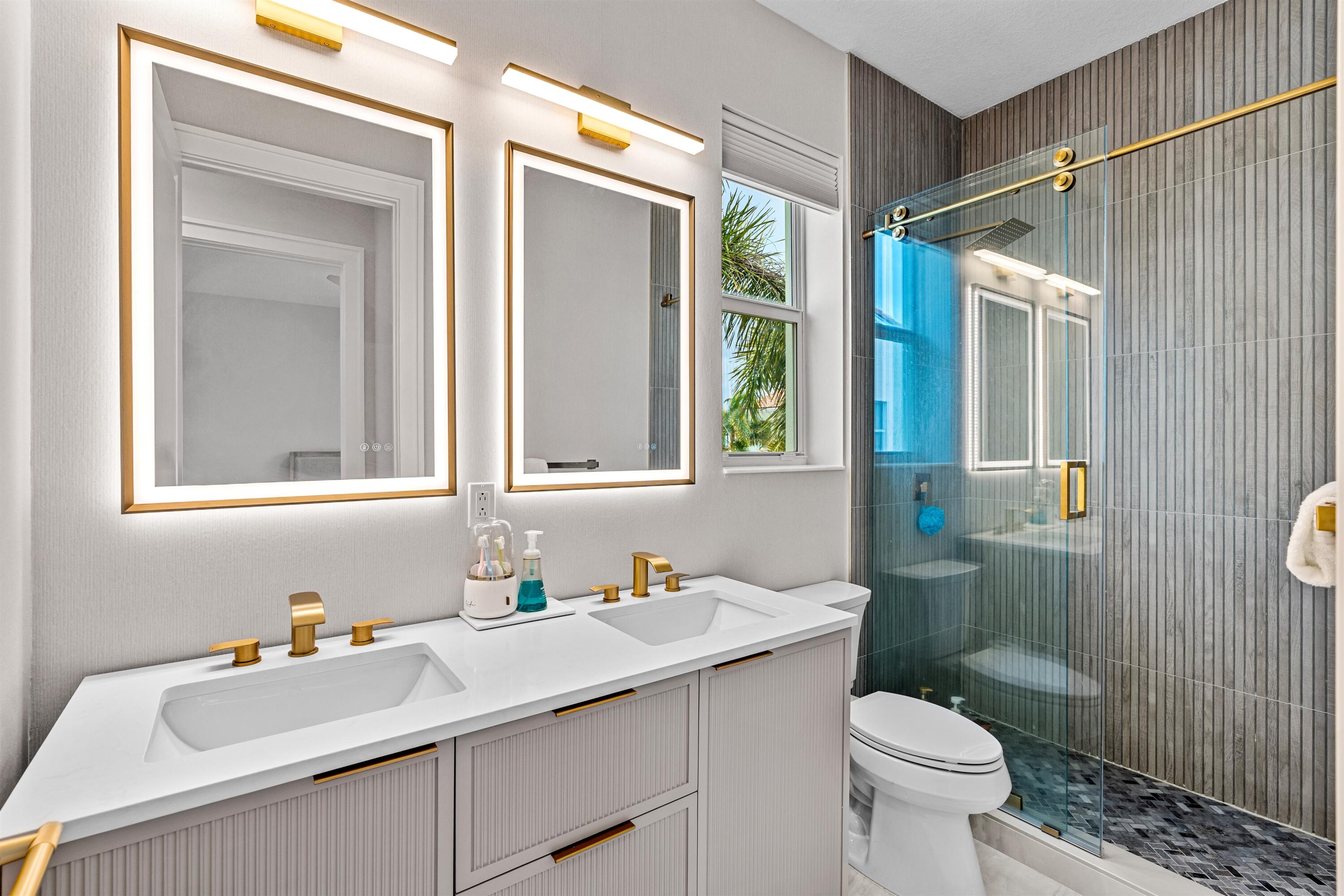 1570 Northwest 48th Place Boca Raton, FL 33431 - Photo 25 of 30 a bathroom with a sink toilet and shower