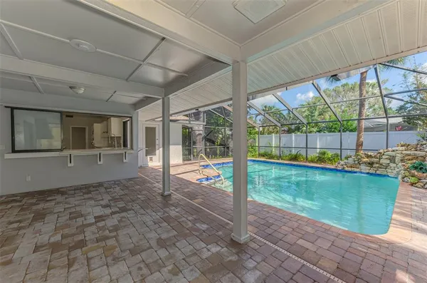 a view of a backyard with a patio and wooden floor