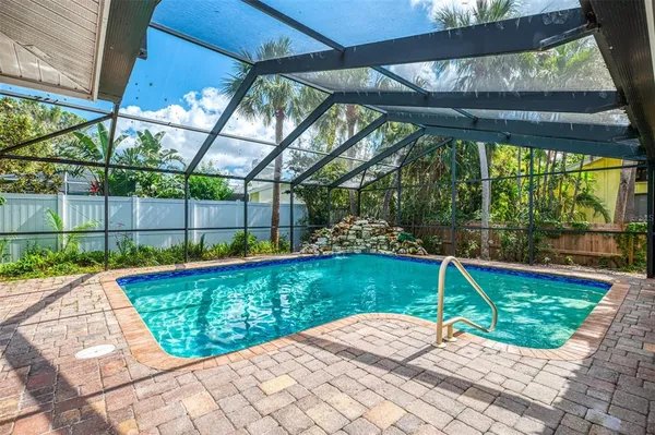 a view of swimming pool with a patio