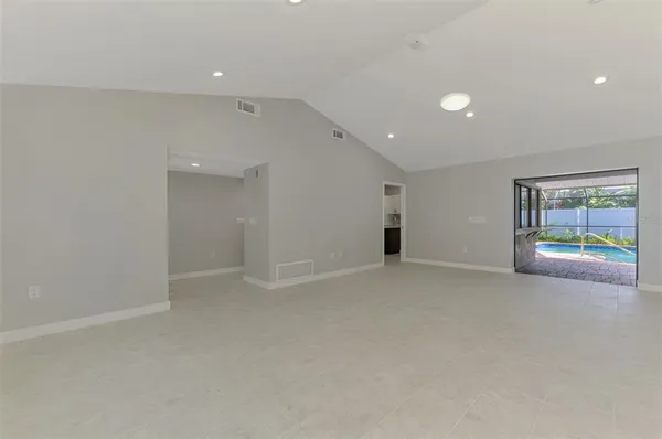 an empty room with windows and view