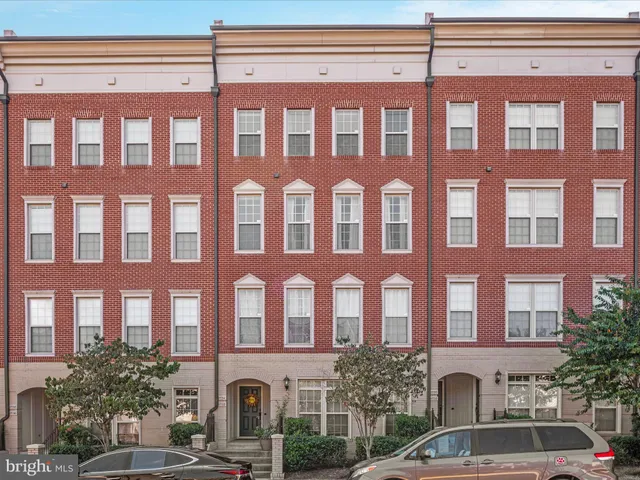 a front view of a building with a lot of windows