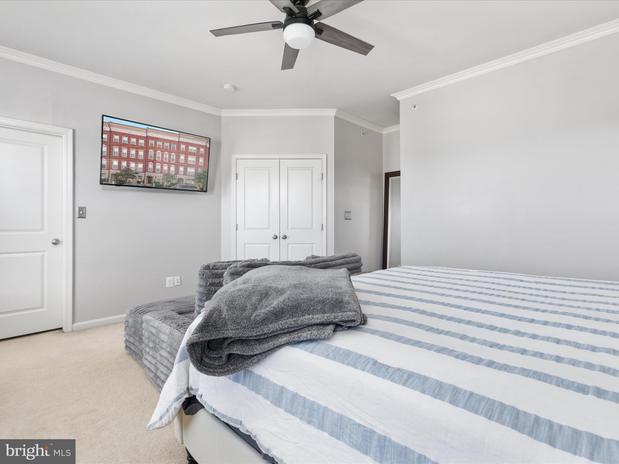 7734 Cedar Branch Drive Gainesville, VA 20155 - Photo 19 of 62 a bedroom with a bed and a ceiling fan