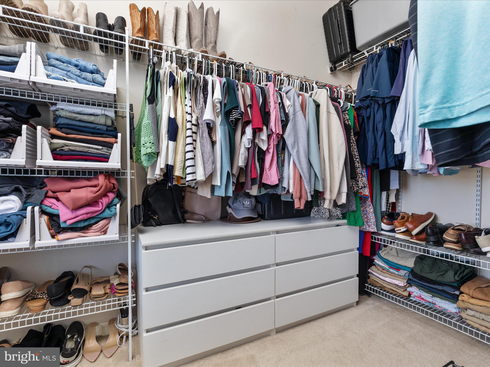 7734 Cedar Branch Drive Gainesville, VA 20155 - Photo 20 of 62 a view of walk in closet with clothes and shoes