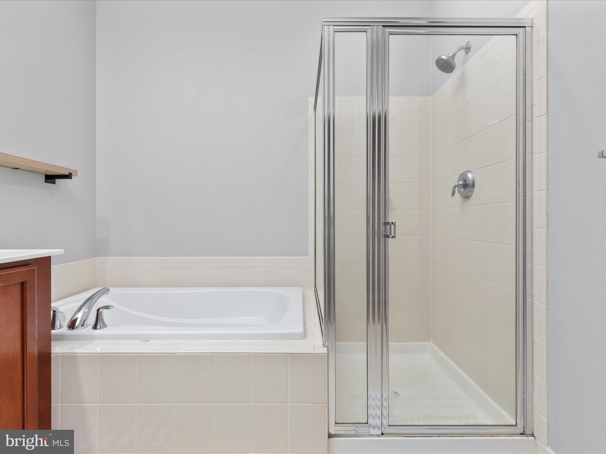 7734 Cedar Branch Drive Gainesville, VA 20155 - Photo 22 of 62 a bathroom with a bathtub and a shower