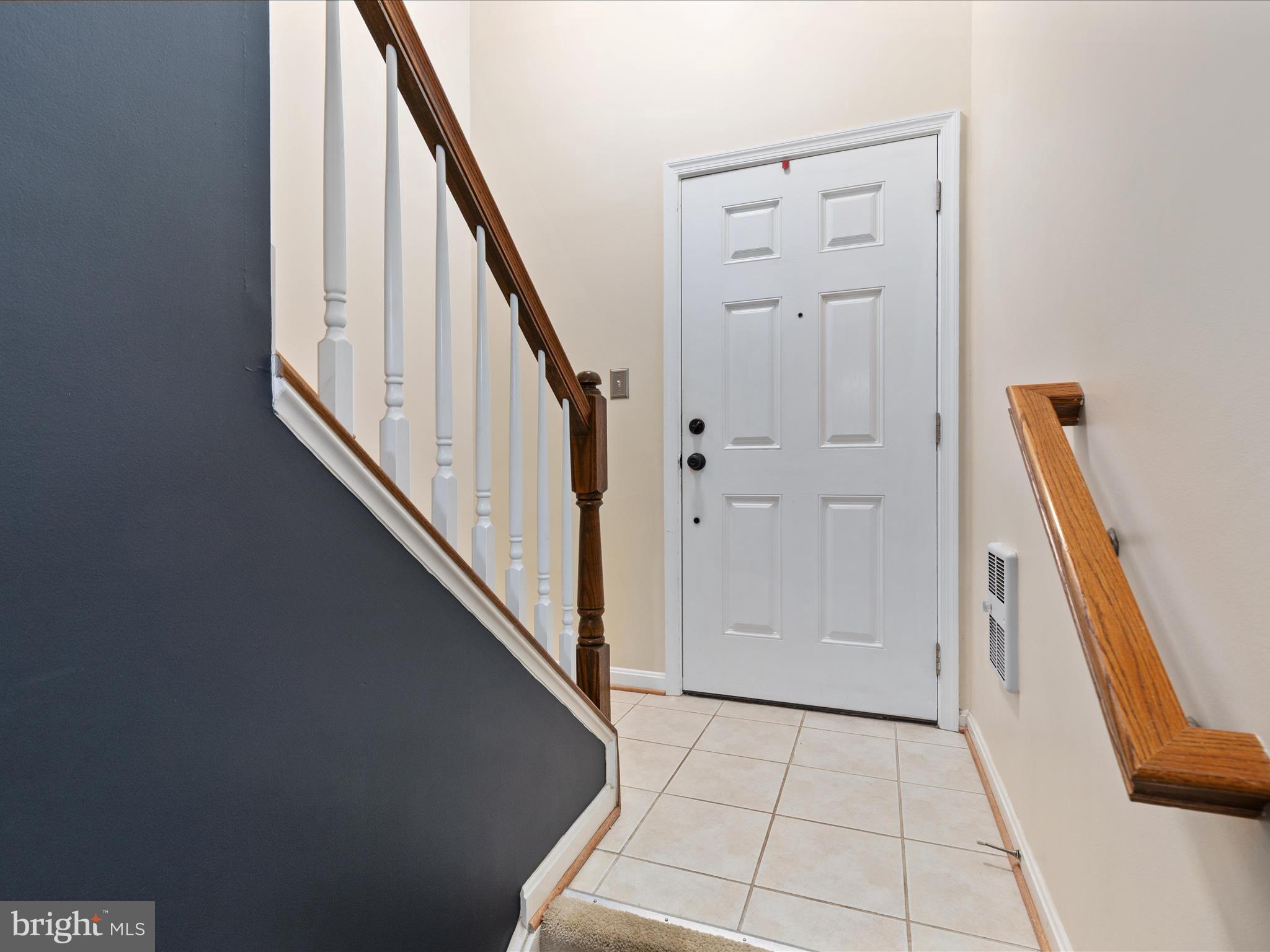 7734 Cedar Branch Drive Gainesville, VA 20155 - Photo 3 of 62 a view of an entryway with staircase