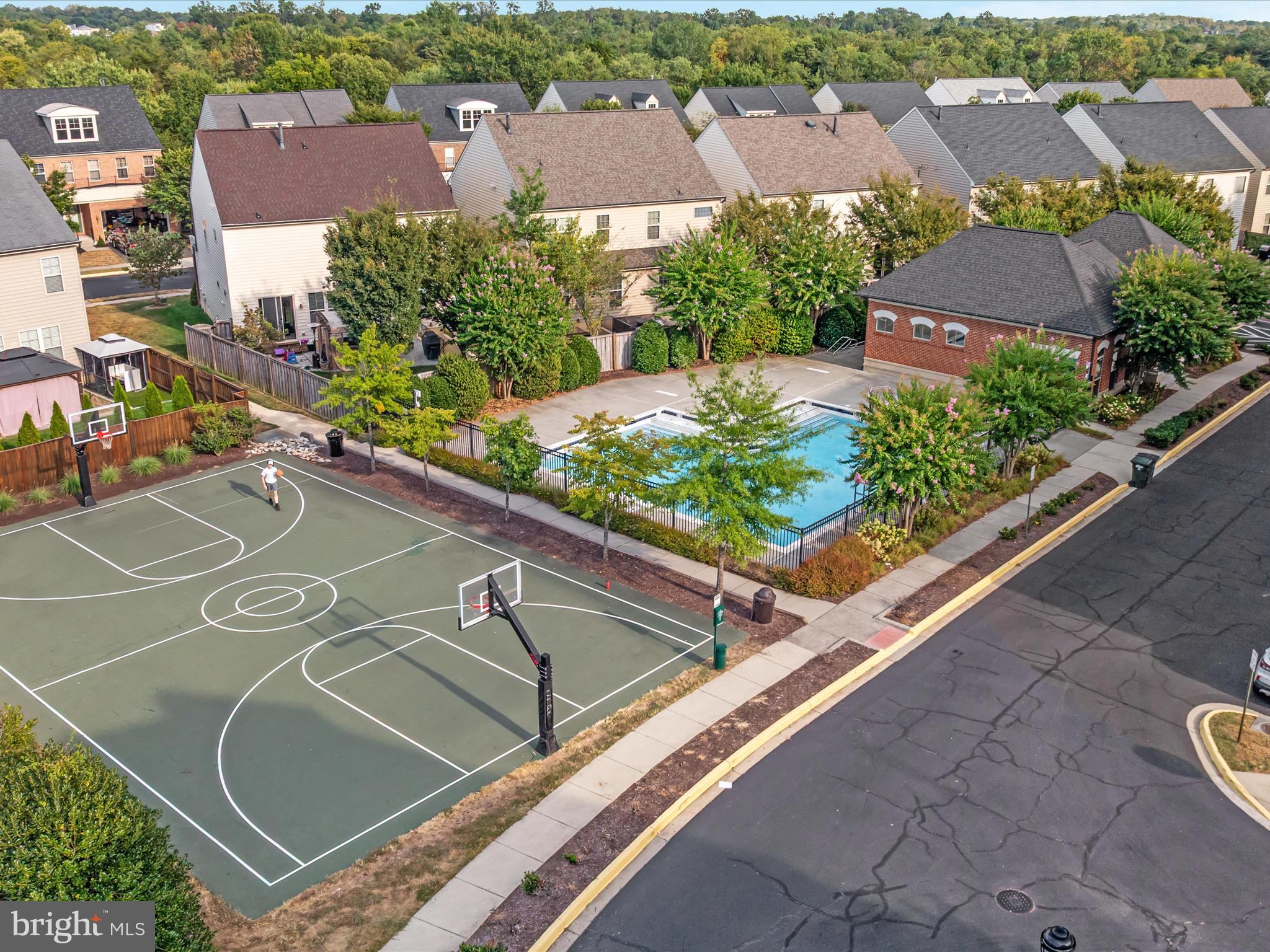 7734 Cedar Branch Drive Gainesville, VA 20155 - Photo 59 of 62 an aerial view of a tennis ground and a cars park