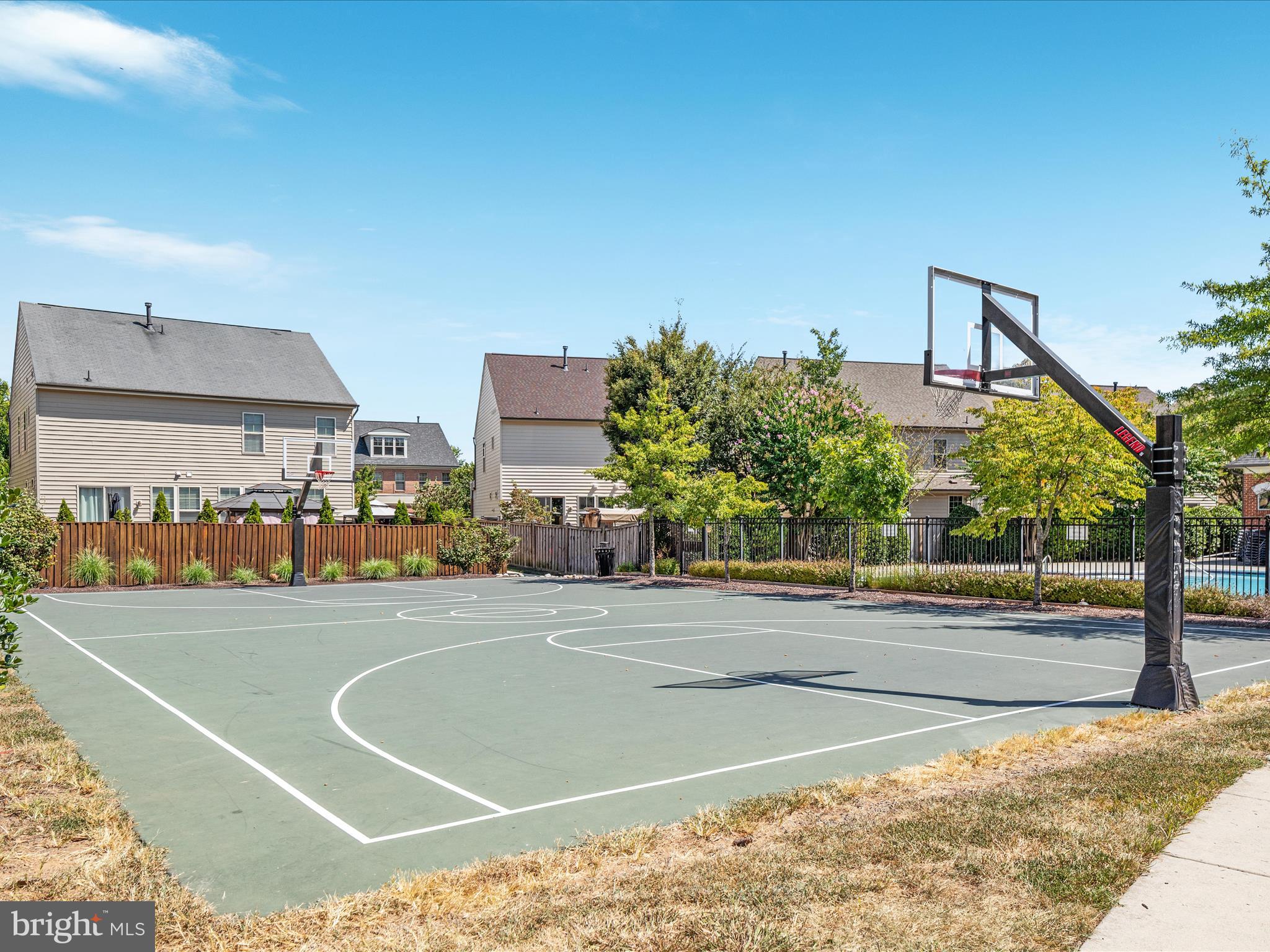 7734 Cedar Branch Drive Gainesville, VA 20155 - Photo 60 of 62 a view of a swimming pool and a yard