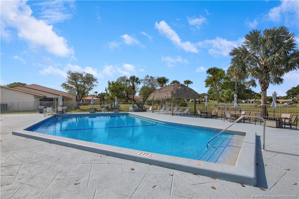 5323 Southeast Miles Grant Road, Unit 206 Stuart, FL 34997 - Photo 20 of 20 a view of outdoor space and swimming pool