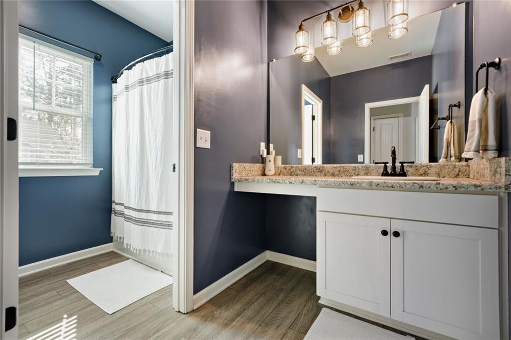 153 Bryon Lane Acworth, GA 30102 - Photo 17 of 25 a bathroom with a sink and a mirror