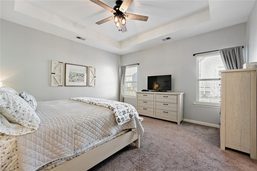 153 Bryon Lane Acworth, GA 30102 - Photo 18 of 25 a bedroom with a bed a flat screen tv and a window