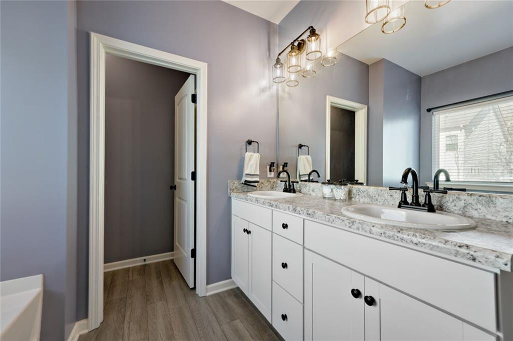153 Bryon Lane Acworth, GA 30102 - Photo 20 of 25 a bathroom with double vanity sinks and a mirror