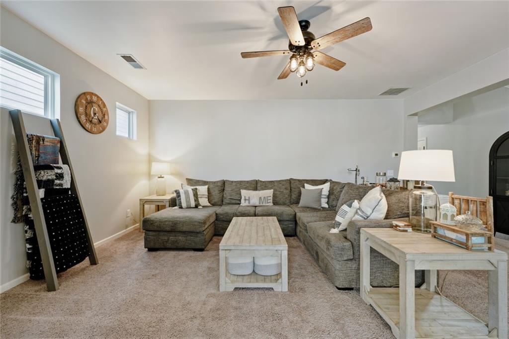 153 Bryon Lane Acworth, GA 30102 - Photo 7 of 25 a living room with furniture and a flat screen tv