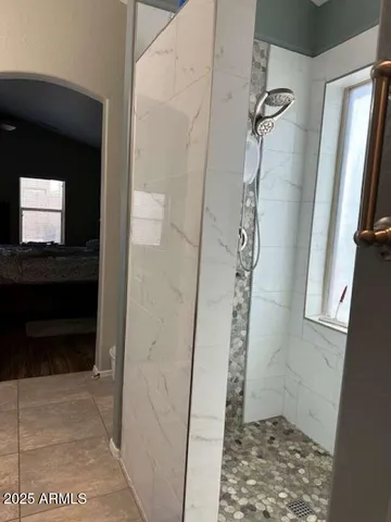 a view of a patio with table and chairs potted plants and large tree