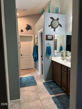 a view of a patio with table and chairs potted plants and large tree