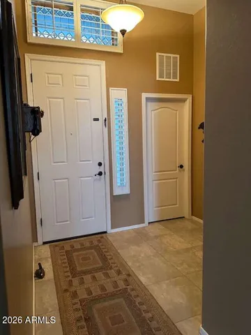 a bedroom with bed and window