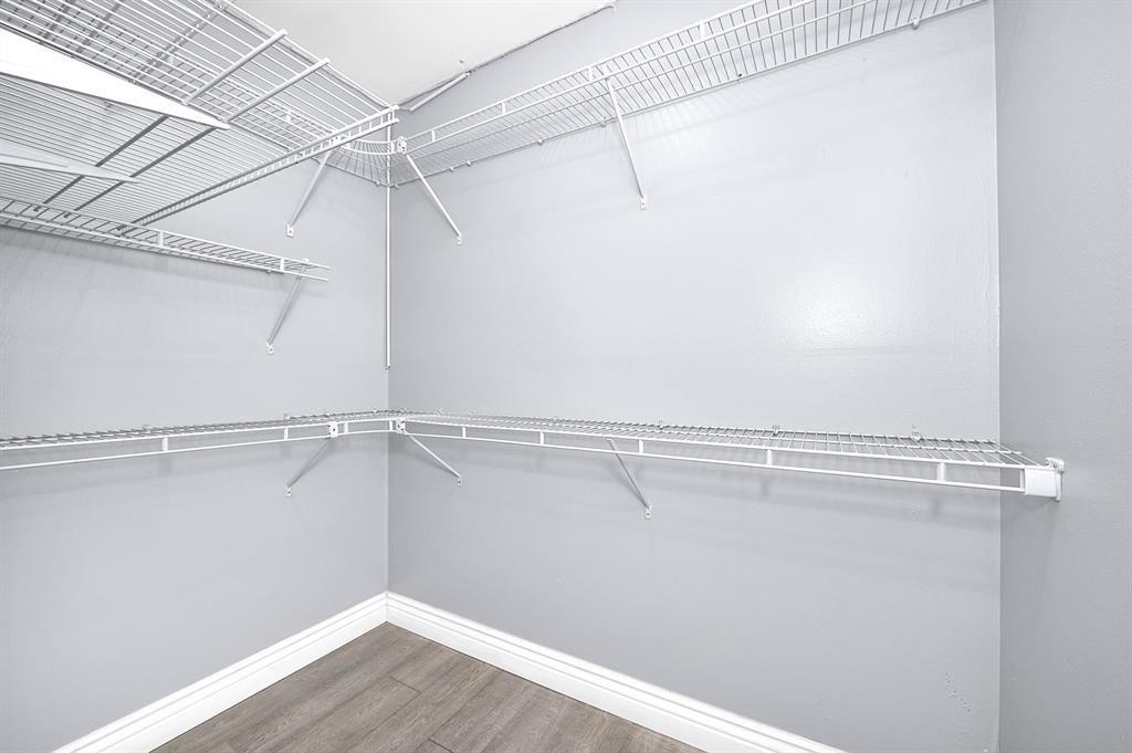 9355 Southwest 8th Street, Unit 401 Boca Raton, FL 33428 - Photo 14 of 37 a view of a room with racks on the wall