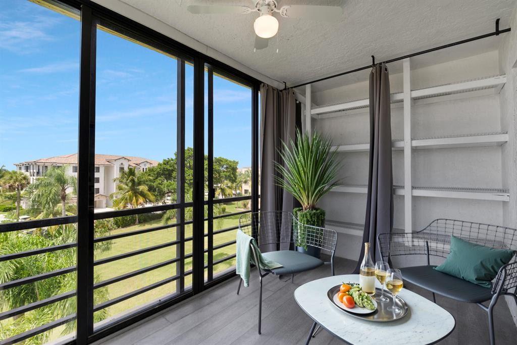 9355 Southwest 8th Street, Unit 401 Boca Raton, FL 33428 - Photo 2 of 37 a living room with furniture and a potted plant