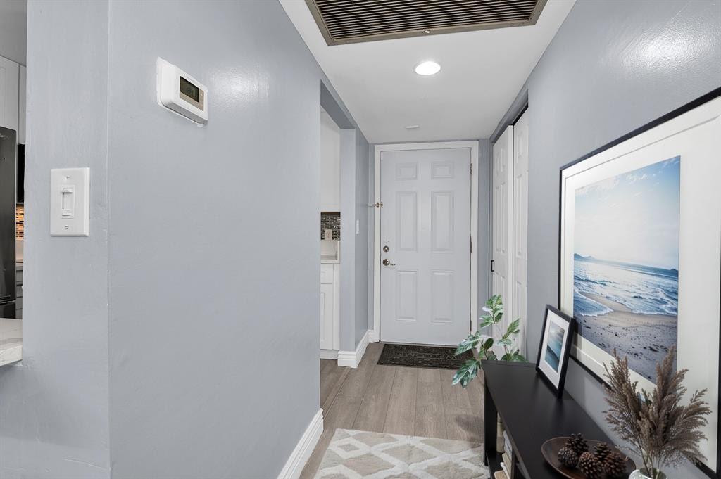9355 Southwest 8th Street, Unit 401 Boca Raton, FL 33428 - Photo 5 of 37 a view of a hallway to a livingroom with furniture