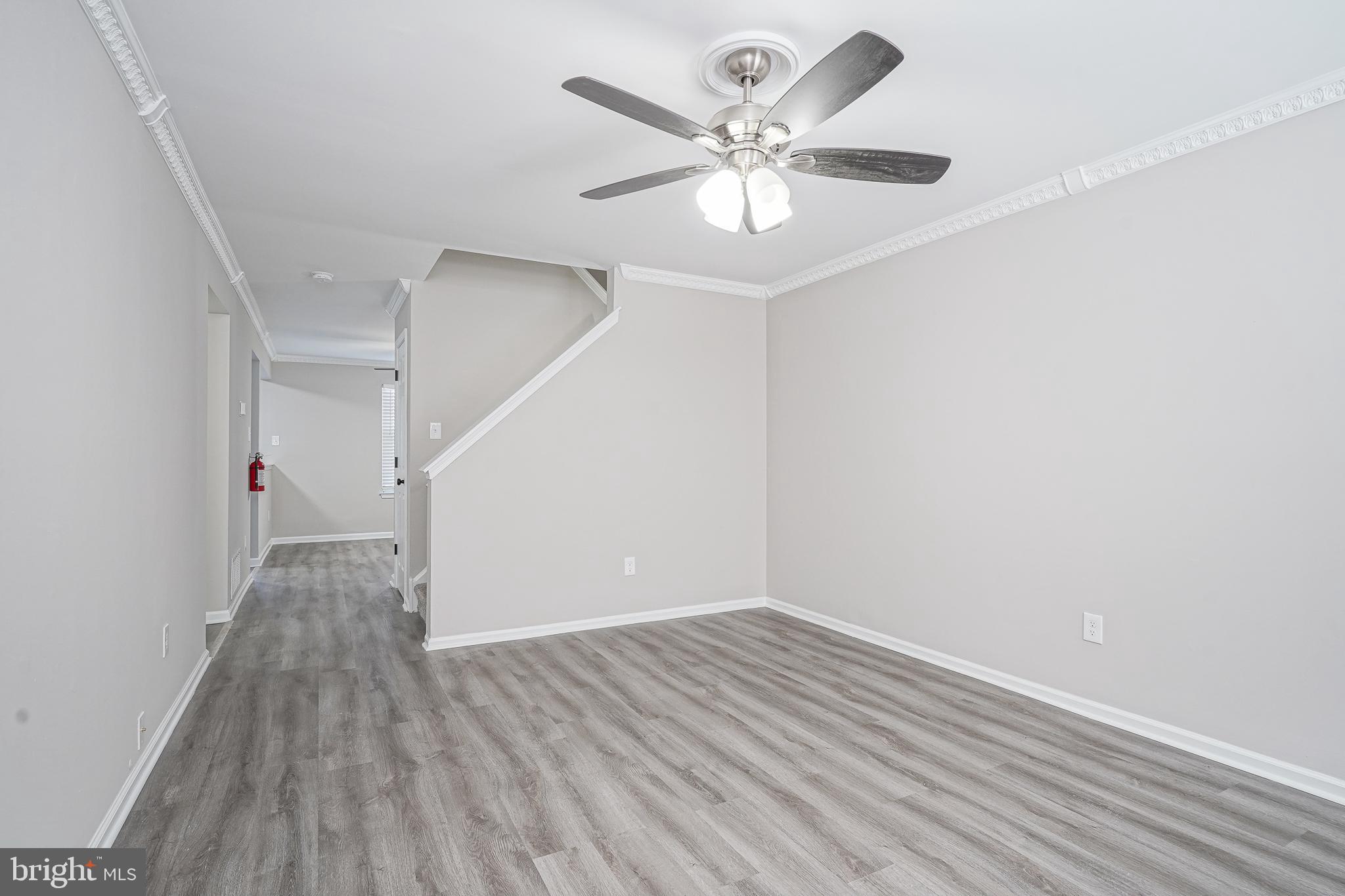 3002 Tall Pines Pine Hill, NJ 08021 - Photo 17 of 29 an empty room with wooden floor and ceiling fan