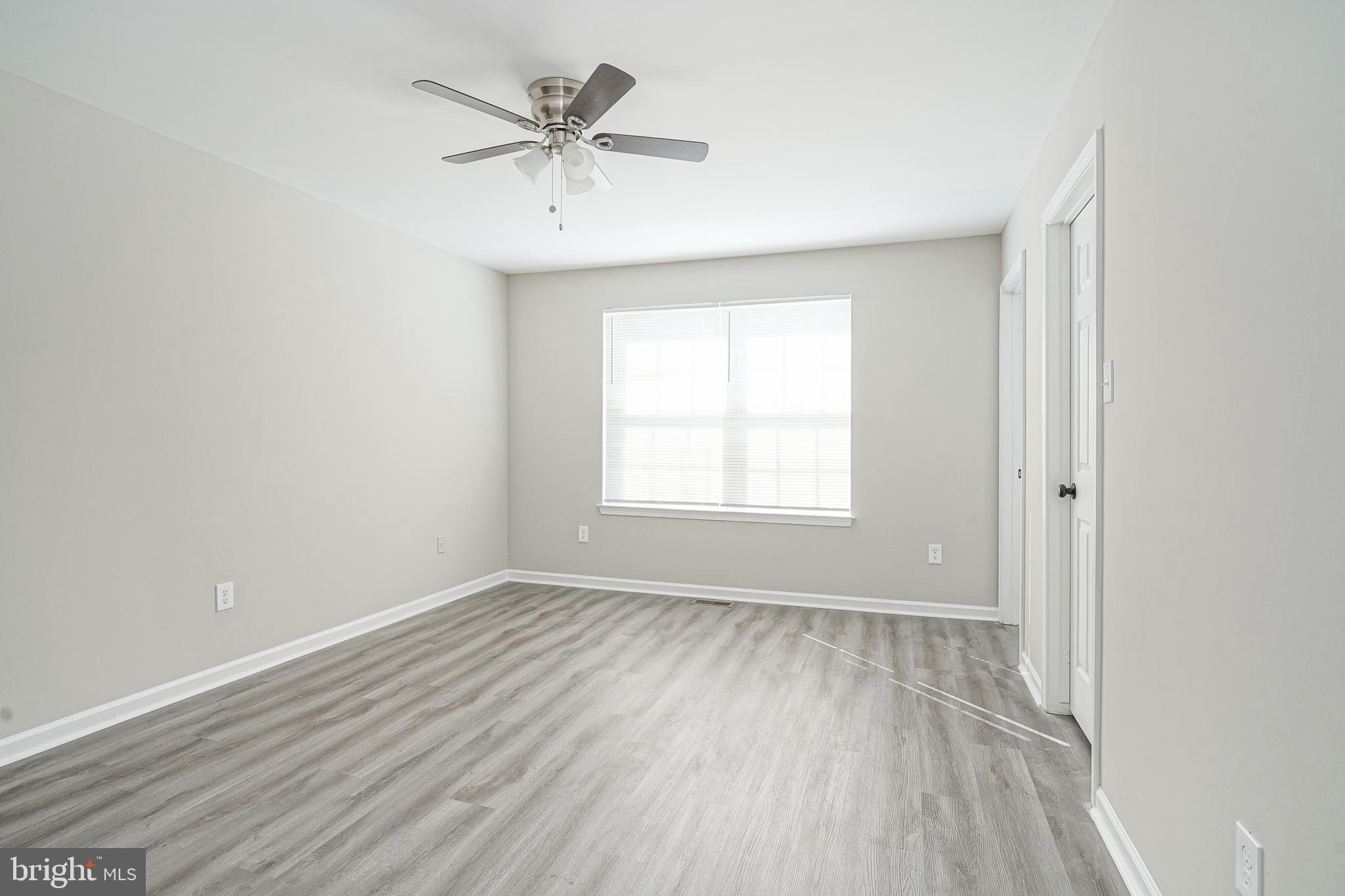 3002 Tall Pines Pine Hill, NJ 08021 - Photo 21 of 29 an empty room with a window and a ceiling fan