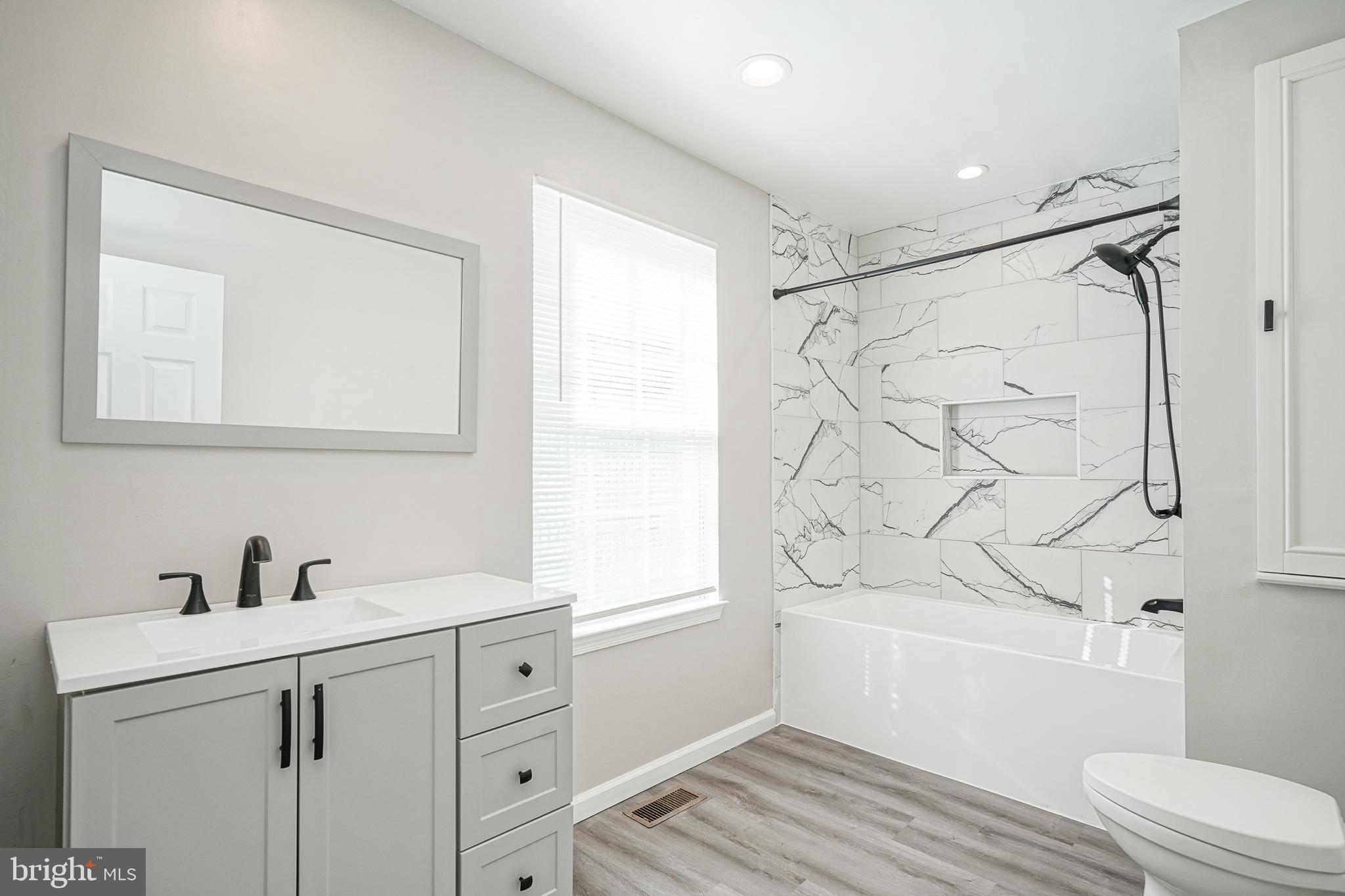 3002 Tall Pines Pine Hill, NJ 08021 - Photo 26 of 29 a bathroom with a sink a mirror toilet and bathtub