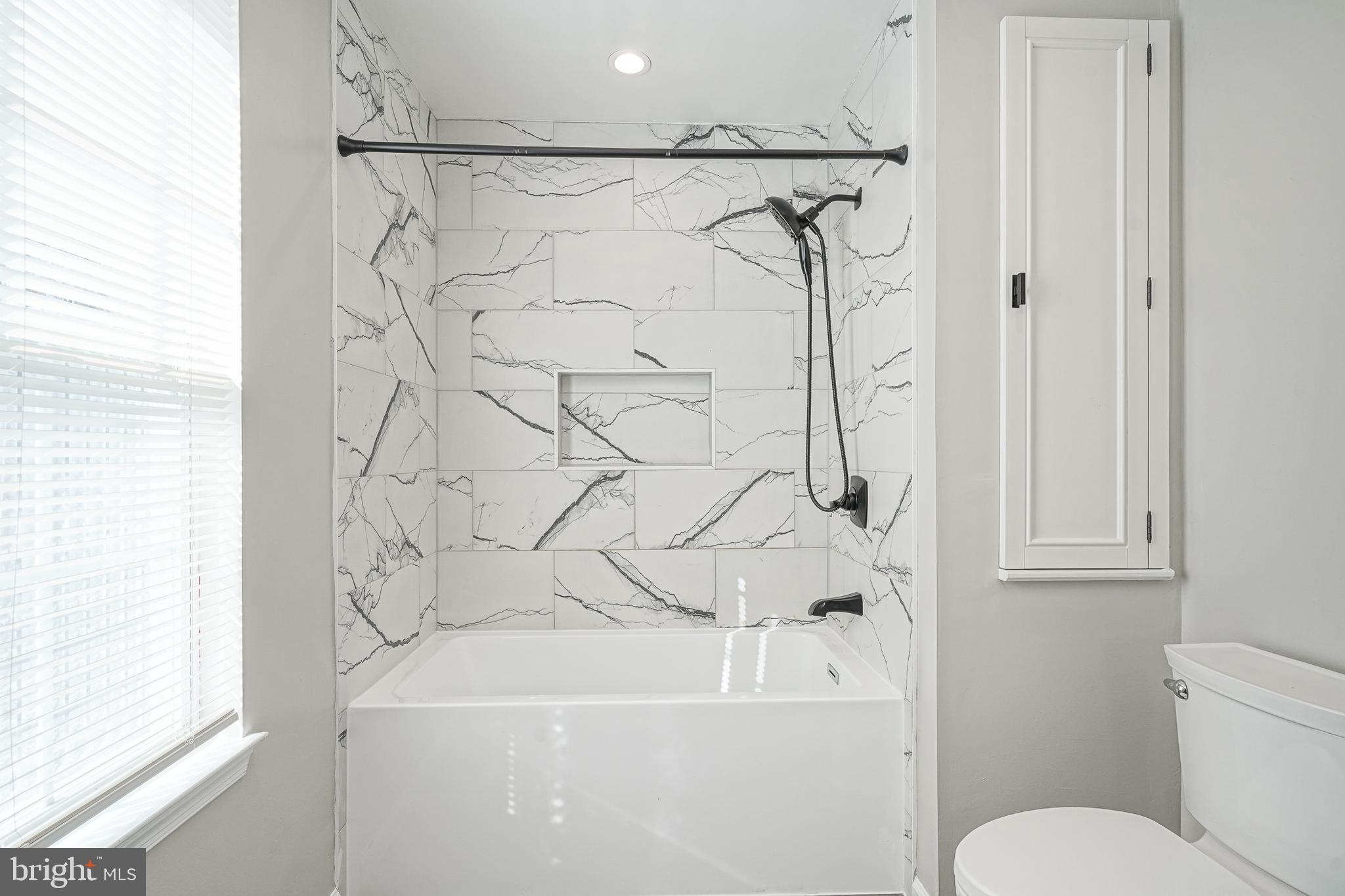 3002 Tall Pines Pine Hill, NJ 08021 - Photo 27 of 29 a bathroom with a bathtub and a shower curtain