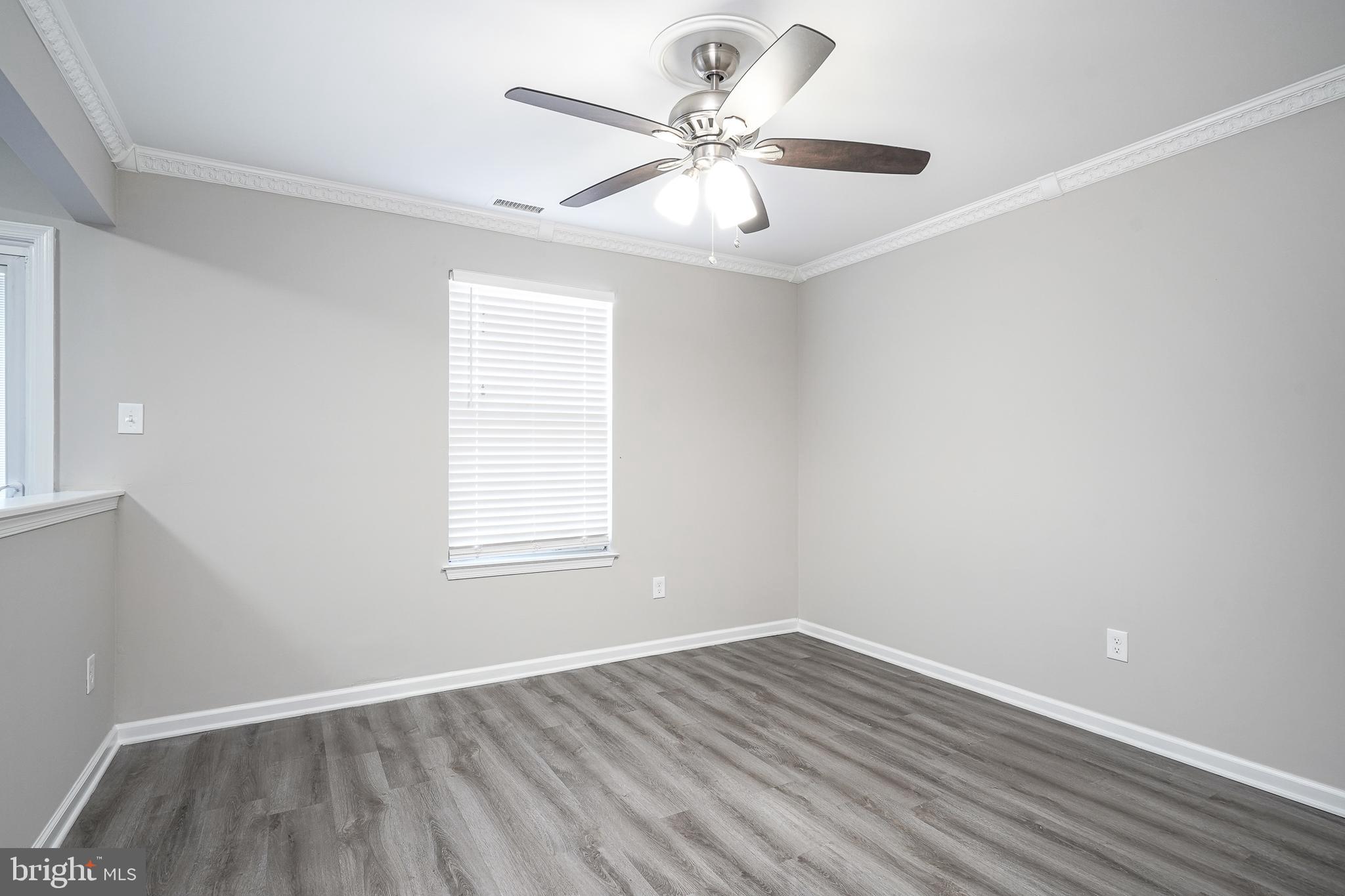 3002 Tall Pines Pine Hill, NJ 08021 - Photo 3 of 29 an empty room with wooden floor and windows