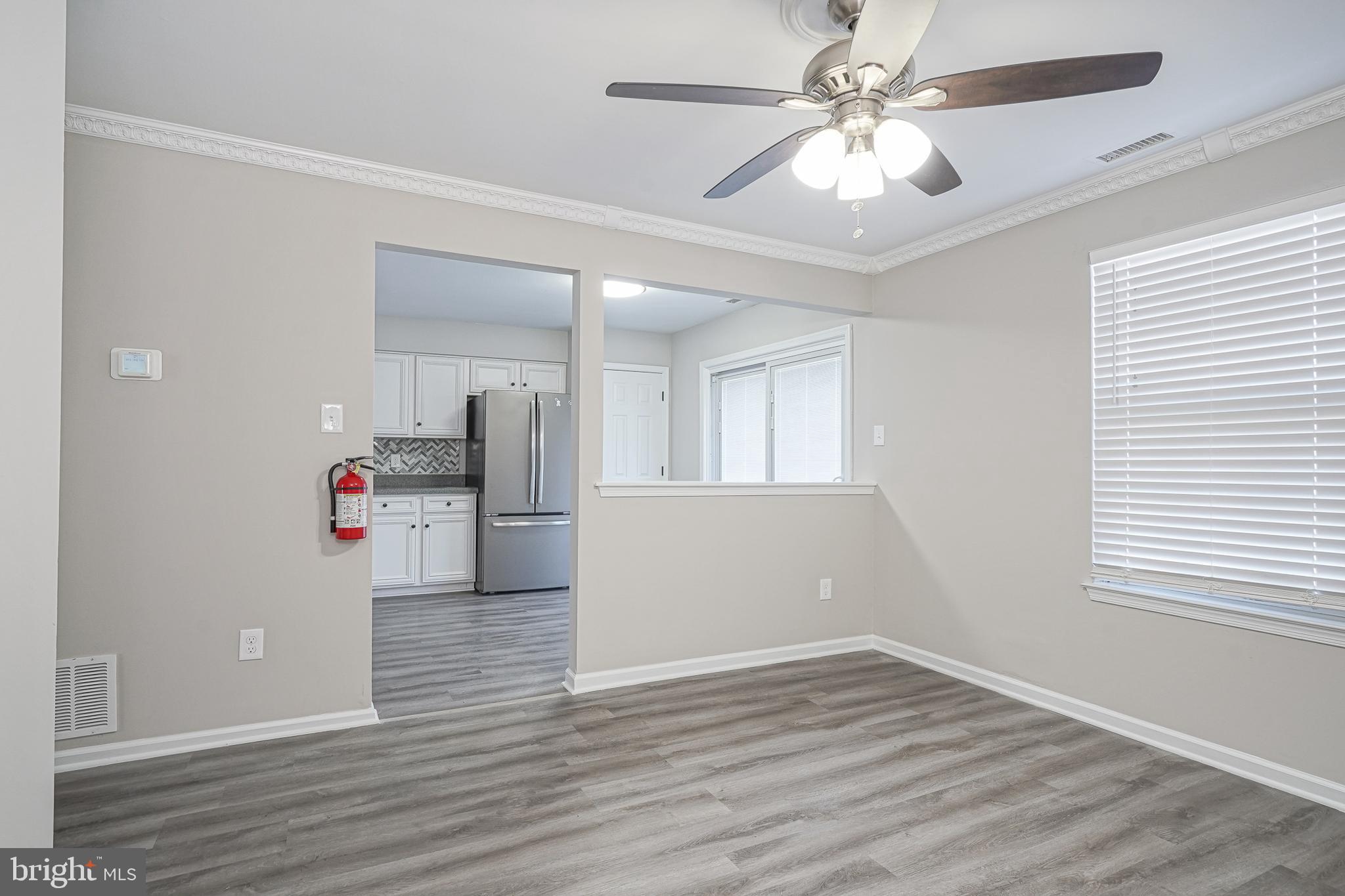 3002 Tall Pines Pine Hill, NJ 08021 - Photo 4 of 29 a view of empty room with wooden floor and ceiling fan