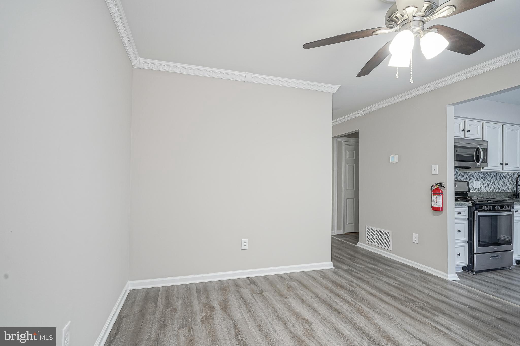 3002 Tall Pines Pine Hill, NJ 08021 - Photo 5 of 29 a view of a livingroom with wooden floor and ceiling fan