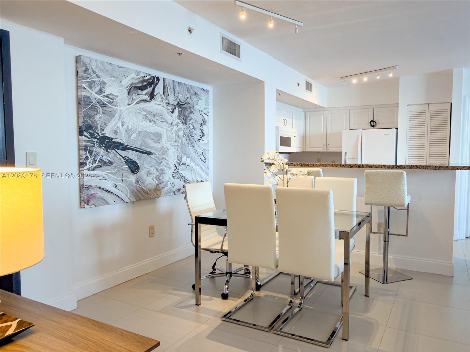 90 Alton Road, Unit 1710 Miami Beach, FL 33139 - Photo 6 of 16 Open dining space perfect for entertaining next to the kitchen area