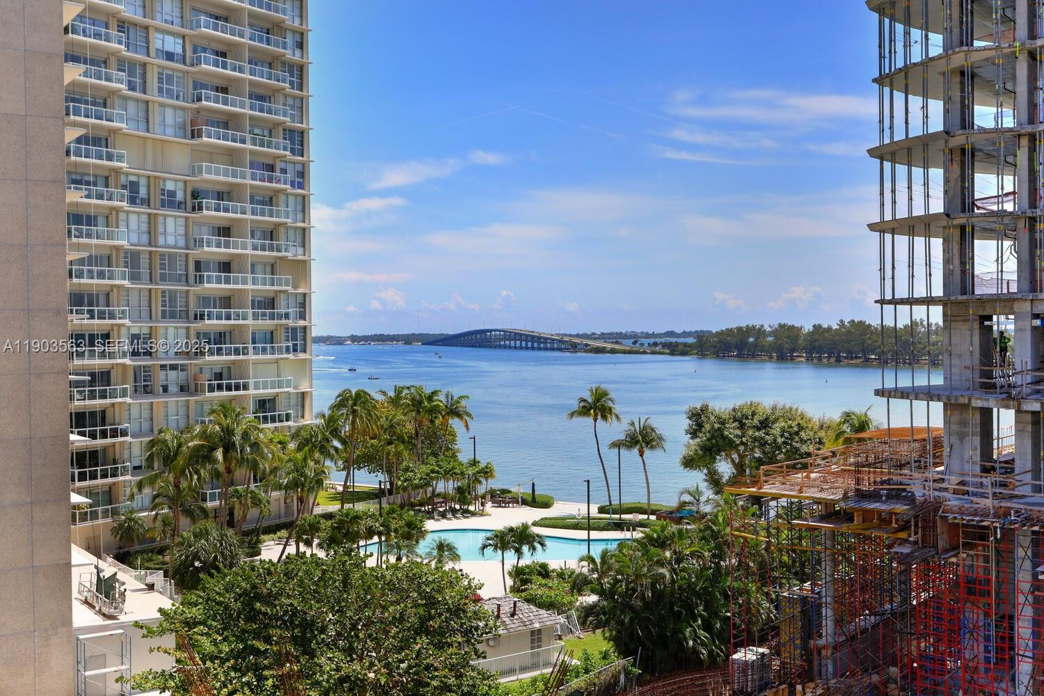 145 Southeast 25th Road, Unit 702 Miami, FL 33129 - Photo 21 of 27 a view of a lake with building in front of it