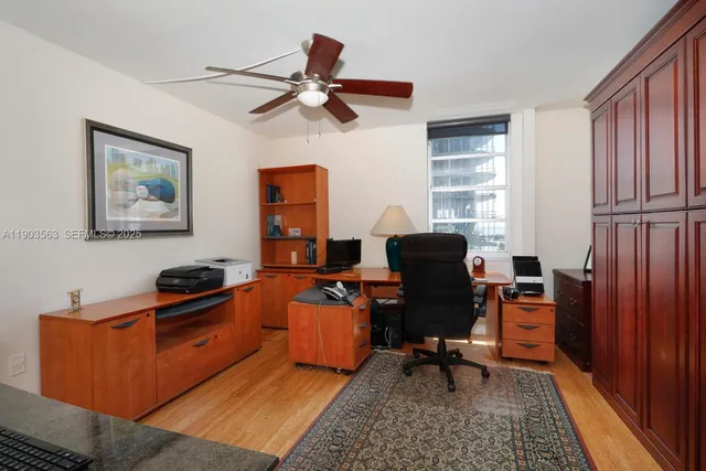 a work room with furniture and windows