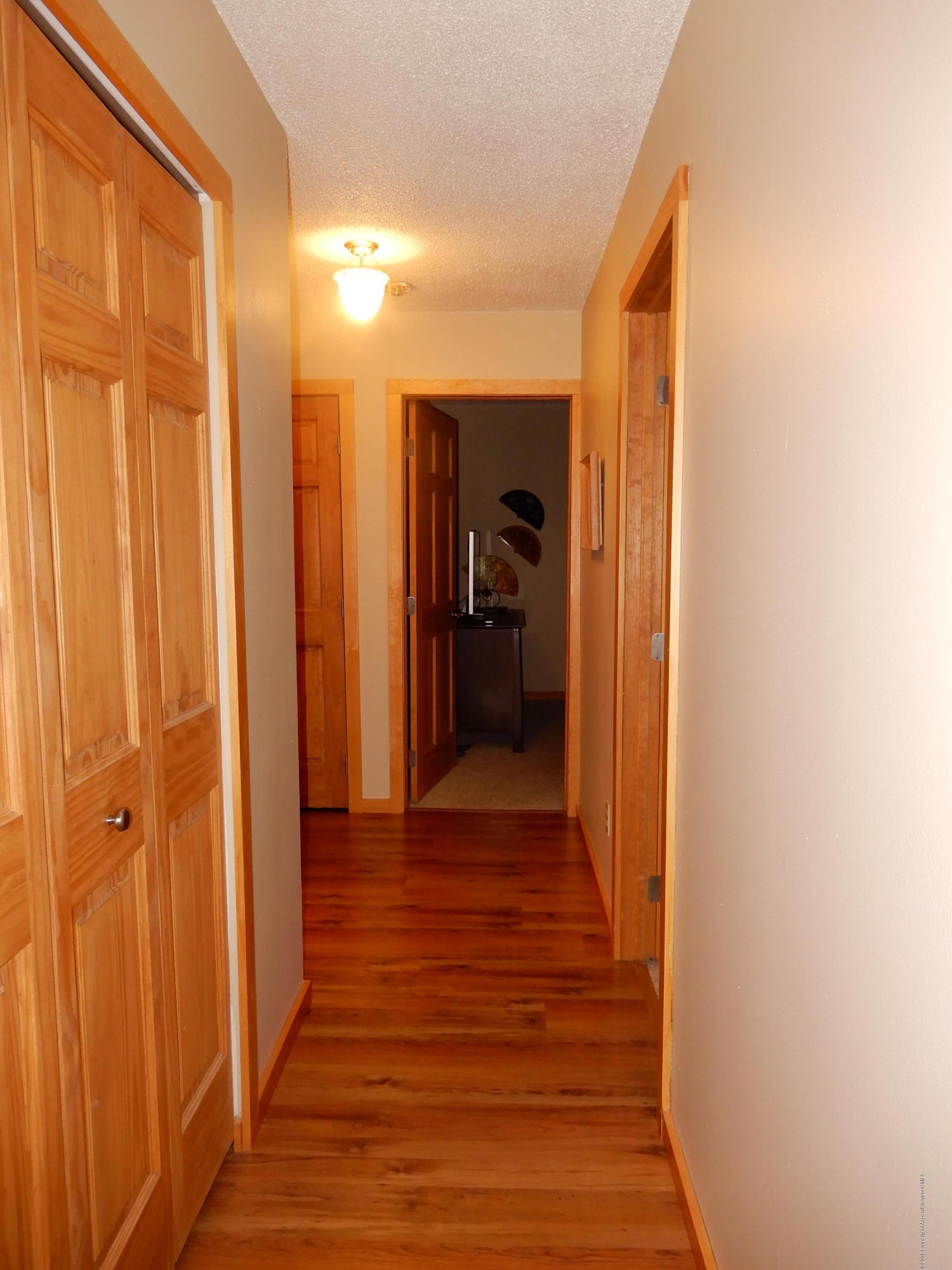 560 Will Avenue Rifle, CO 81650 - Photo 12 of 18 a view of a hallway with wooden floor