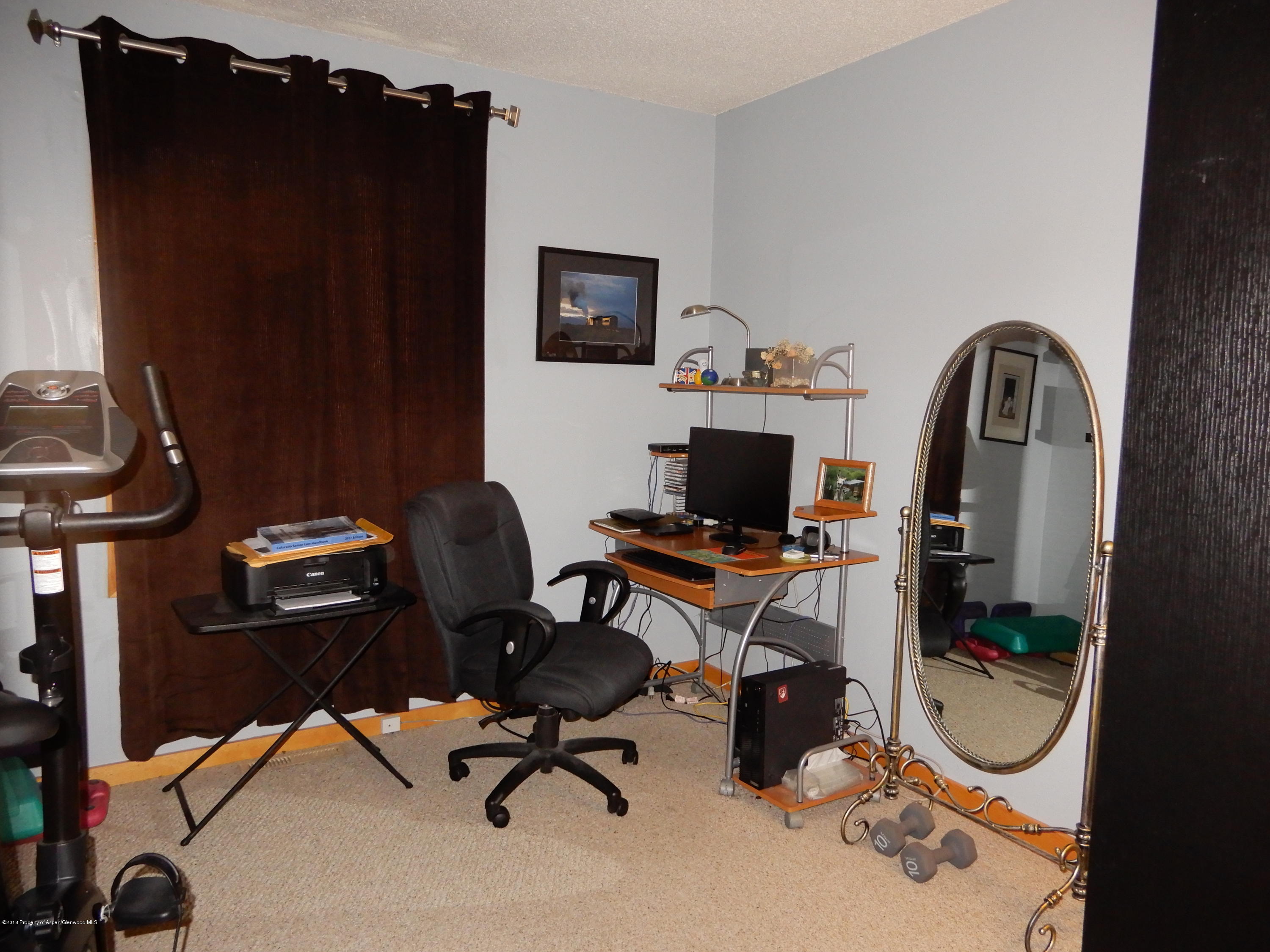 560 Will Avenue Rifle, CO 81650 - Photo 13 of 18 a view of a workspace with furniture and a gate
