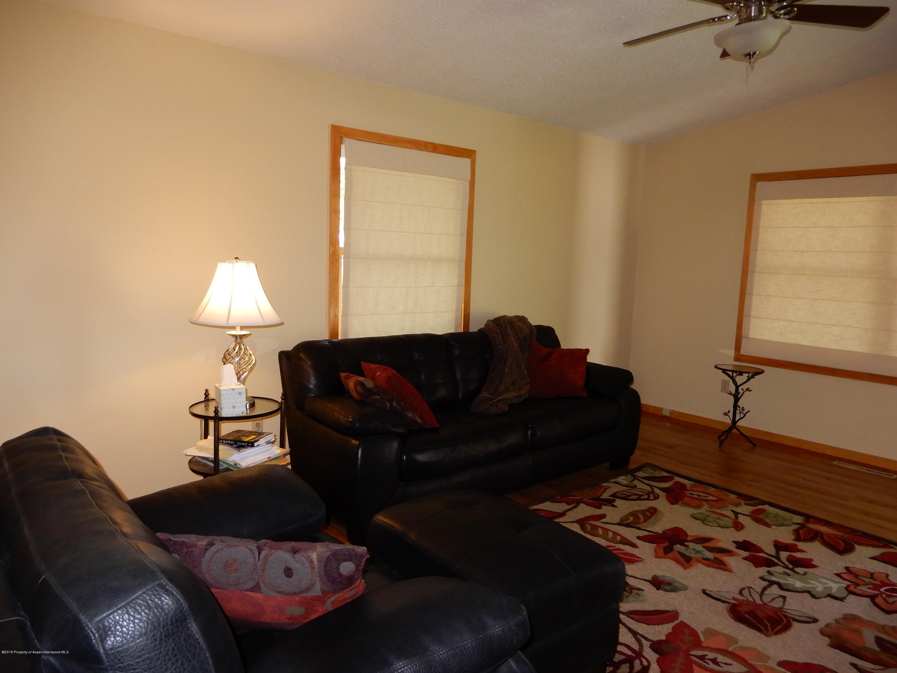560 Will Avenue Rifle, CO 81650 - Photo 6 of 18 a living room with furniture and a window