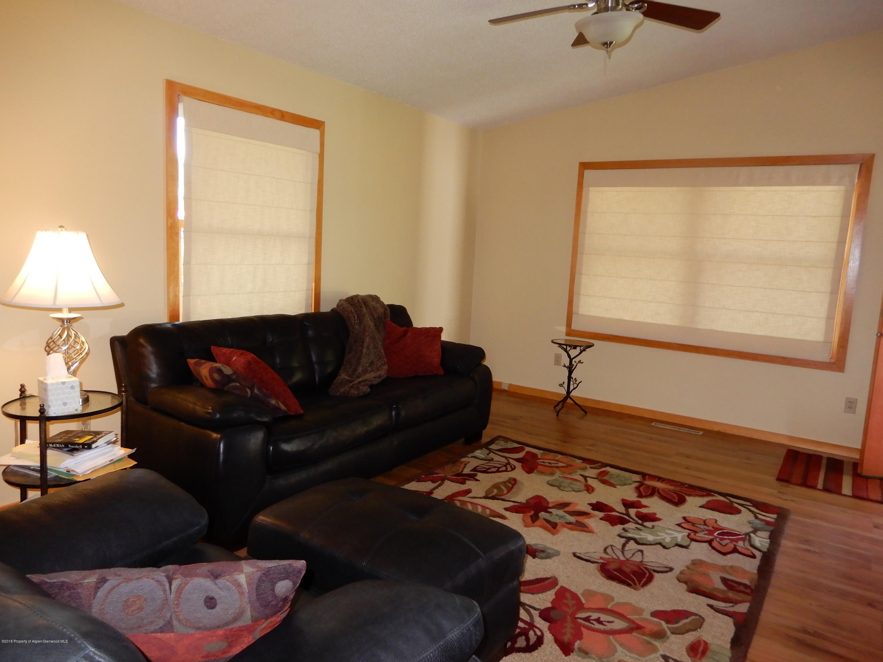 560 Will Avenue Rifle, CO 81650 - Photo 7 of 18 a living room with furniture and a window