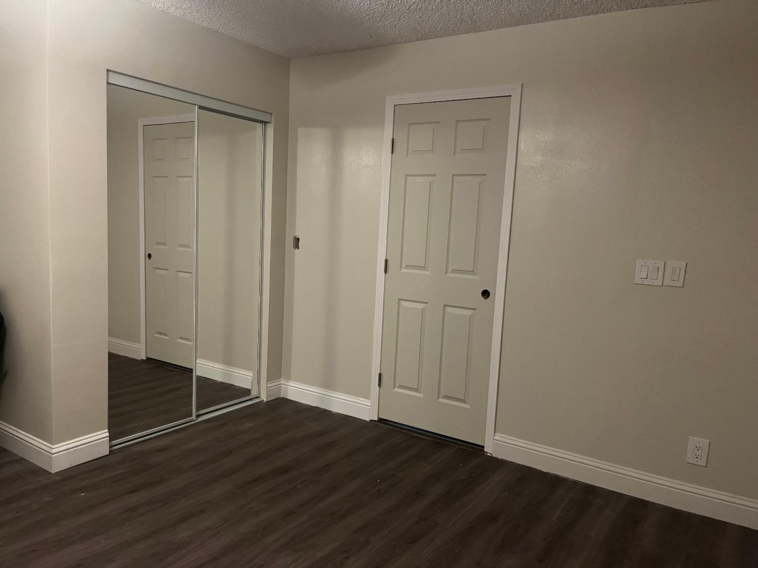 800 Wessmith Way Madera, CA 93638 - Photo 14 of 24 a view of an empty room with wooden floor and closet