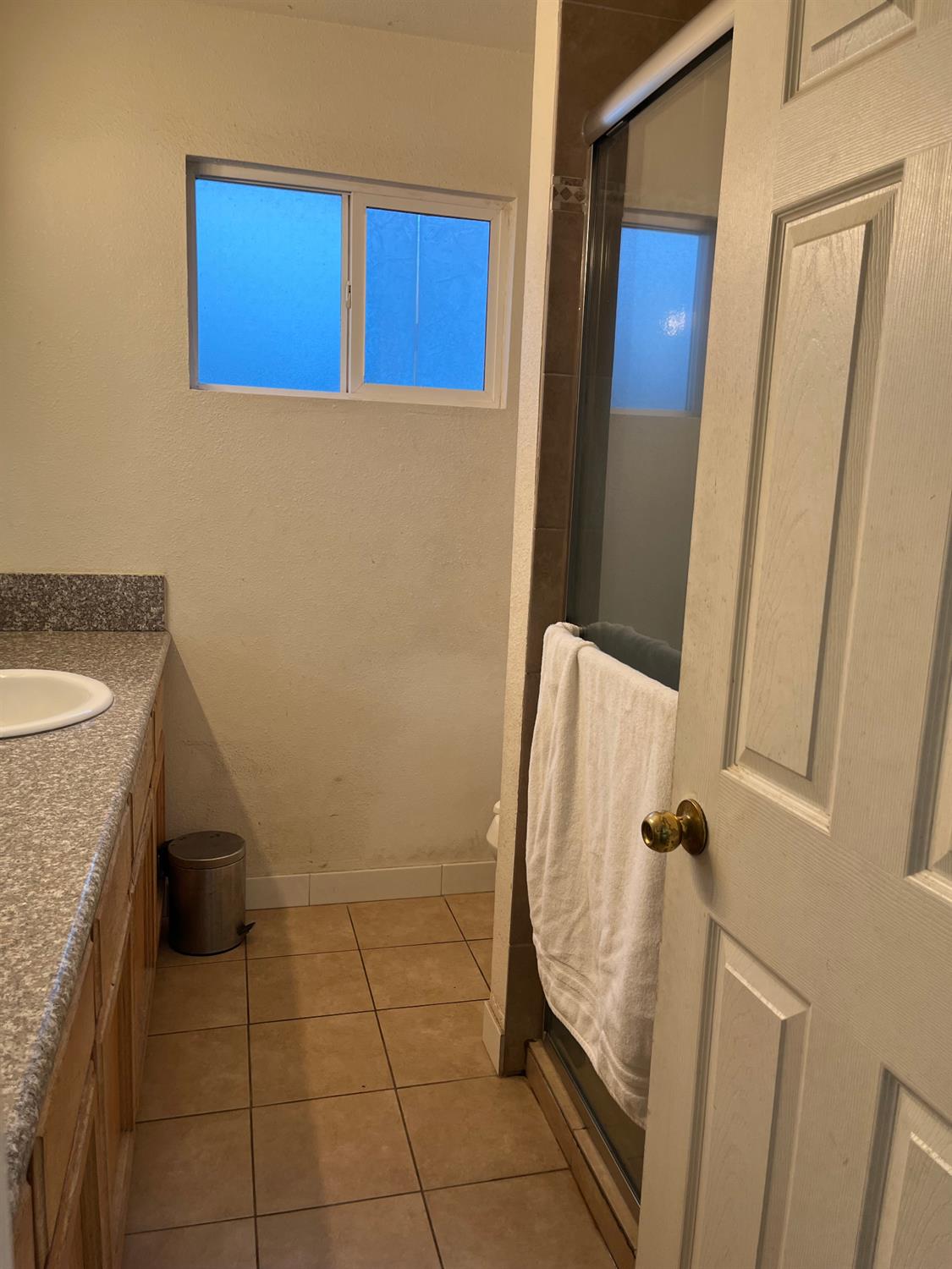 800 Wessmith Way Madera, CA 93638 - Photo 16 of 24 a bathroom with a sink and a mirror