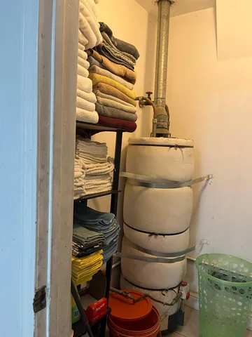 a bathroom with a toilet and a mirror