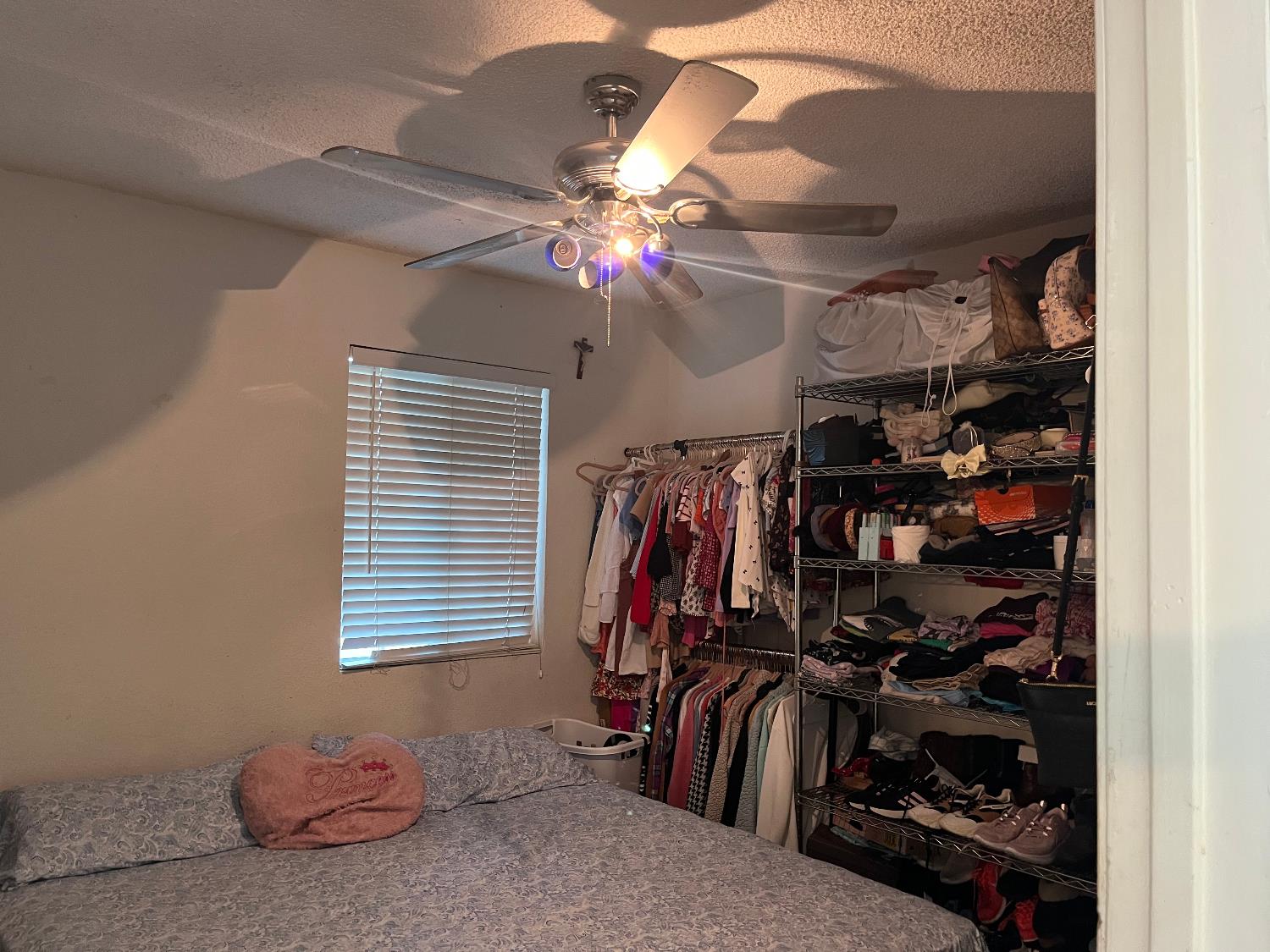 800 Wessmith Way Madera, CA 93638 - Photo 10 of 24 a view of walk in closet with clothes and shoes