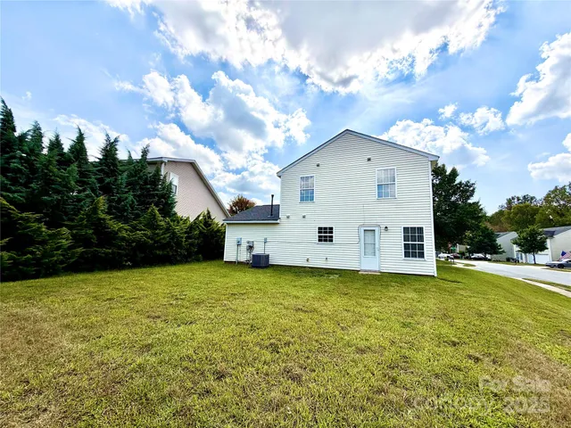 a view of a patio with table and chairs and potted plants